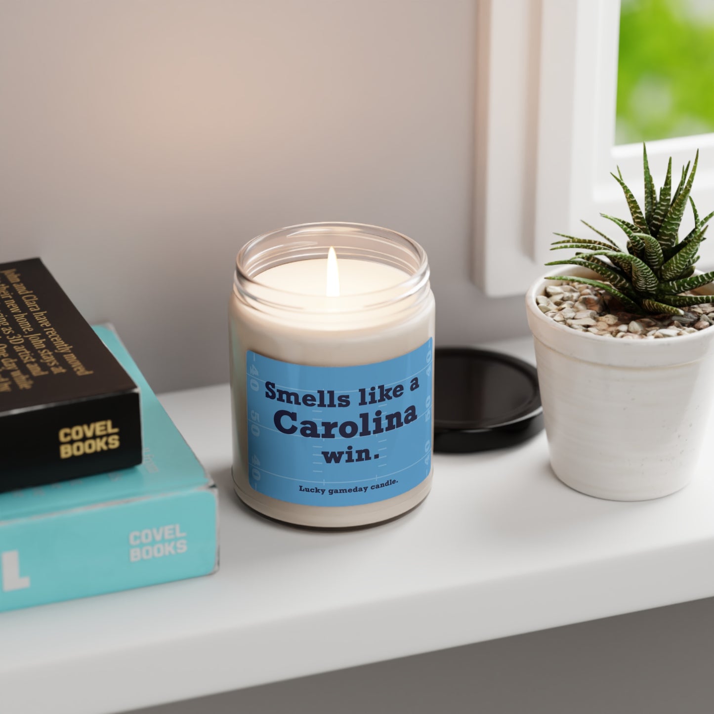 UNC Football - "Smells like a Carolina win" scented candle (9 oz)