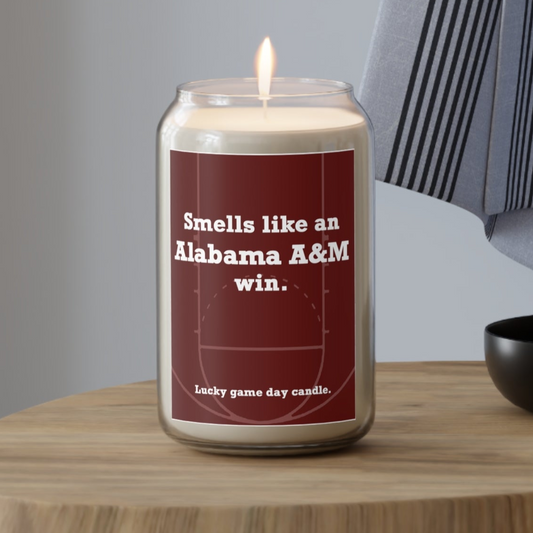 Candle with text on a wooden table with a neutral background