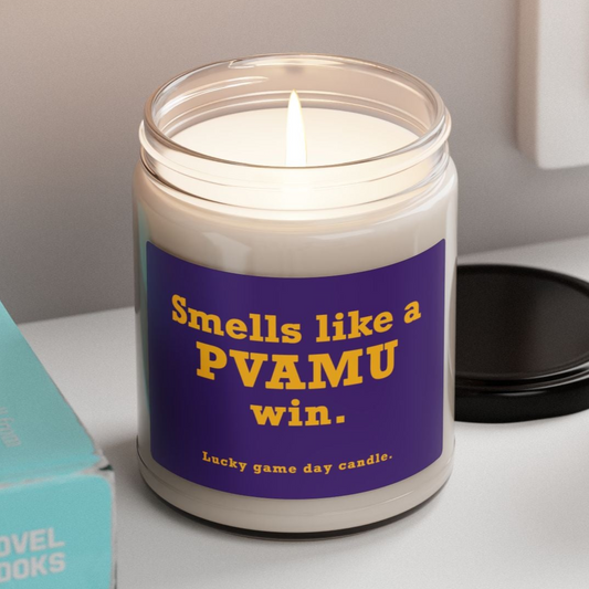 PVAMU candle with a purple label reading 'Smells like a PVAMU win' on a white surface.